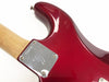 Close-up of red electric guitar body showing neck joint plate with serial number P28875 and maple neck at Coffee House Guitars.