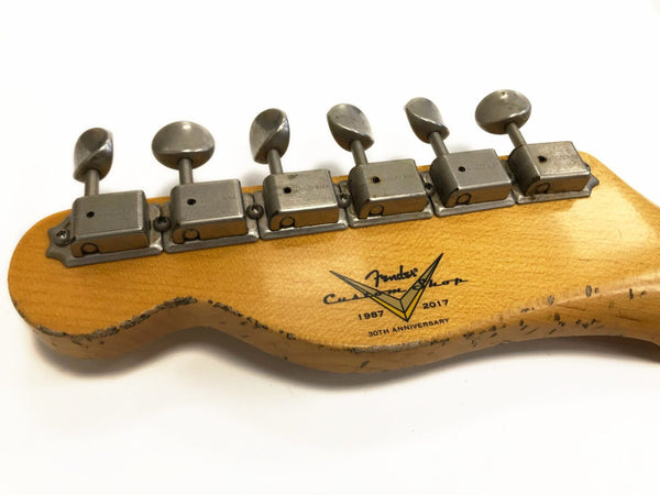Close-up of Fender Custom Shop 30th Anniversary guitar headstock with vintage-style tuning pegs and aged wood finish, 1987-2017 edition