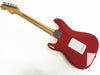 Back view of red electric guitar with maple neck and chrome tuning pegs on a white background
