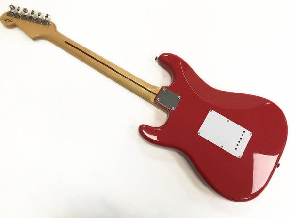 Back view of red electric guitar with maple neck and chrome tuning pegs on a white background