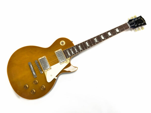 Gibson Les Paul electric guitar honey sunburst finish with dual humbucker pickups and white pickguard isolated on white background