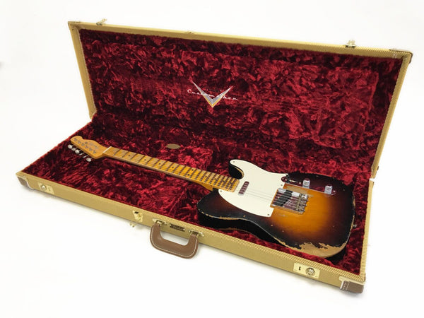 Vintage sunburst Fender Telecaster electric guitar with maple neck and worn finish in tweed hard case with red plush interior