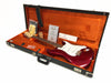 Fender electric guitar in candy apple red finish with white pickguard in vintage black hard case with orange plush interior including certificate of authenticity and accessories