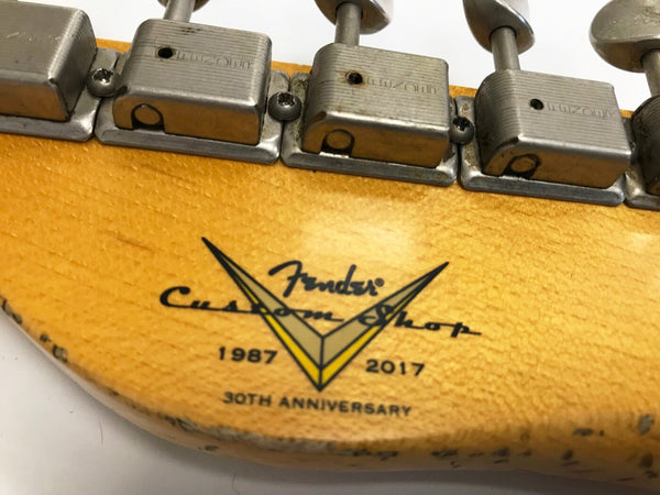 Close-up of Fender Custom Shop 30th Anniversary 1987-2017 guitar headstock with vintage tuners and detailed logo on natural wood finish