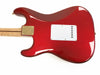 Red electric guitar body with maple neck and white backplate, glossy finish, close-up view of backside with gold neck plate and string ferrules