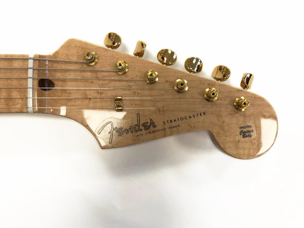 Fender Stratocaster guitar headstock with gold tuning pegs and birdseye maple finish showing original contour body decal.