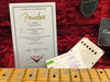 Fender Custom Shop Certificate of Authenticity for Ltd El Diablo Strat Relic dated 07/19/16 with guitar neck, red plush case interior, and Fender pickup cover.