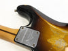 Close-up of Fender Limited Edition guitar neck plate with serial number CZ528792 and worn sunburst finish body showing wood grain and paint wear