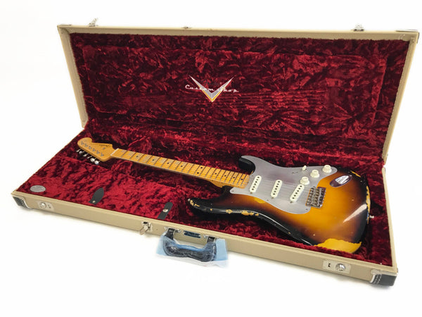Vintage sunburst Fender Stratocaster electric guitar with maple neck in tan hard case lined with red plush interior at Coffee House Guitars