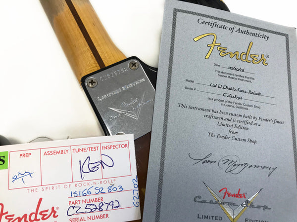 Close-up of Fender Limited Edition guitar neck plate with serial number CZ528792 and Certificate of Authenticity for Fender Ltd EL Diablo Strat Relic from Fender Custom Shop, dated 07/19/16, along with Fender inspection and tuning card.