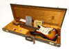 Vintage Fender Stratocaster electric guitar in sunburst finish inside tan hard case with certificate of authenticity and Fender cleaning cloth