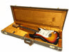 Fender Stratocaster electric guitar in sunburst finish inside vintage brown hard case with orange plush interior