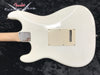 White Fender electric guitar body back with maple neck and chrome neck plate on black textured background with Fender Custom Shop logo.