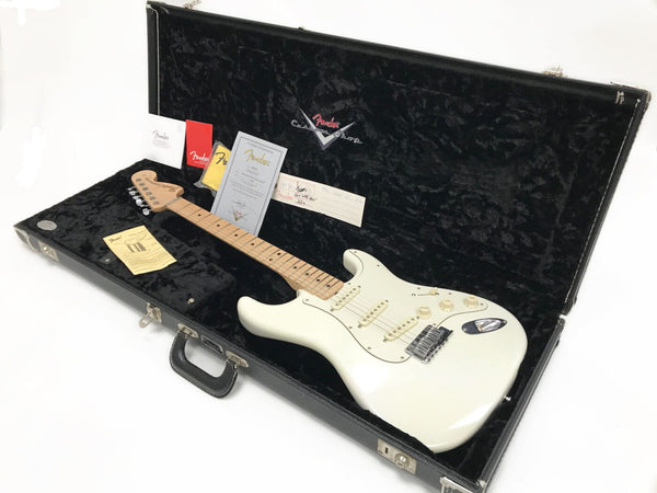 Fender Custom Shop white Stratocaster electric guitar with maple neck in black plush-lined hard case, including Fender warranty and authenticity documents