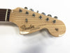 Close-up view of natural wood Fender Stratocaster guitar headstock with chrome tuning pegs and original contour body logo on white background