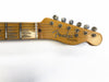 Fender Telecaster guitar headstock with vintage tuning pegs and worn fretboard on white background