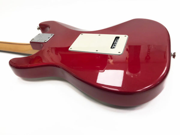 Red electric guitar body with white backplate and maple neck viewed from the back on white background