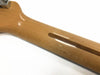 Close-up of glossy finished natural wood guitar neck with visible grain and reinforcement strip against white background