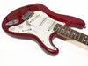 Red electric guitar with white pickguard, three single-coil pickups, and rosewood fretboard on white background