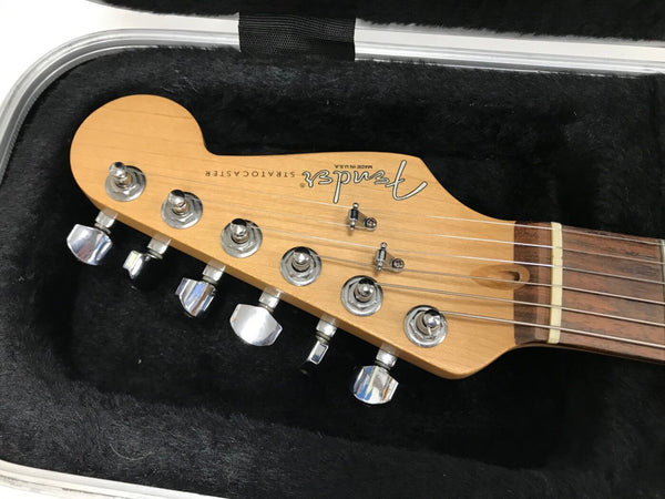 Fender Stratocaster electric guitar maple headstock with chrome tuning pegs in black plush case interior