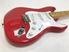Red electric guitar with white pickguard, three single-coil pickups, maple neck, and chrome hardware on white background
