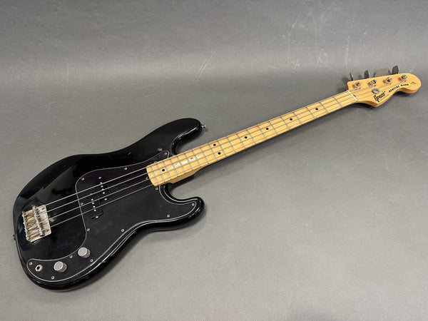 Vintage black Greco Mercury Bass electric guitar with maple neck and fretboard, chrome tuning pegs, and black pickguard on grey background