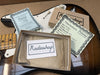 Radioshop guitar pickups certificate of authenticity and pickup specification cards on sunburst electric guitar body with empty Radioshop Pickups box and pickguard details.