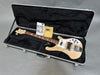Rickenbacker electric bass guitar with light wood finish inside black plush-lined hard case with original manuals and string pack