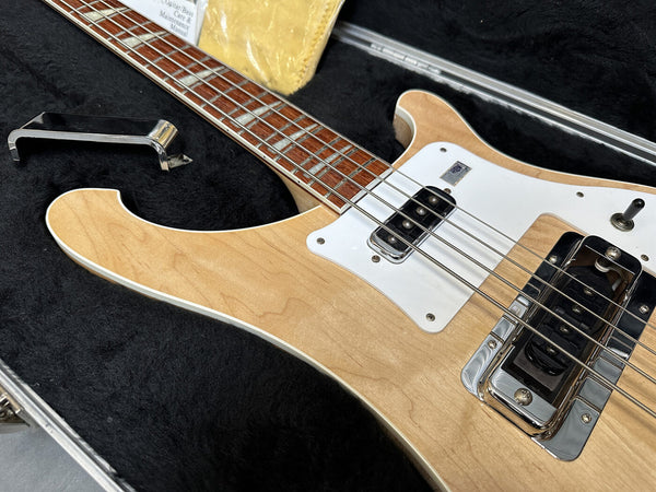 Vintage natural finish electric bass guitar with white pickguard and chrome hardware in black plush case with care manual and metal bridge cover
