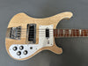 Natural finish electric bass guitar with chrome hardware, white pickguard, and rosewood fretboard on gray background