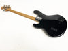 Back view of black electric bass guitar with natural wood neck and chrome tuning pegs on white background