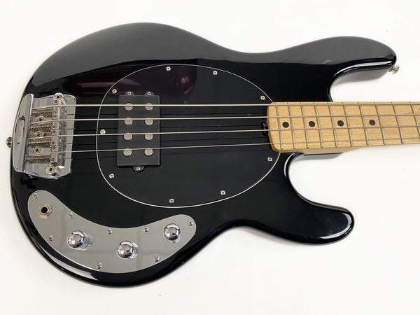 Black electric bass guitar with maple fretboard and chrome hardware on white background