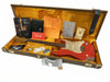 Fender Custom Shop 2017 Custom Guitar in red with gold pickguard, sitting inside vintage hardshell guitar case with yellow interior, accompanied by Fender owner's manual, certificate of authenticity, 2017 custom guitar design guide, black leather pouch, and various Fender tags and documents, showing wear and relic finish on guitar body.