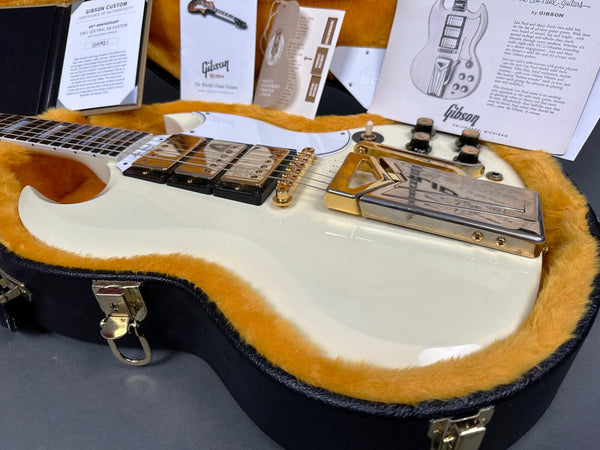 1961 Gibson SG Custom electric guitar in white with gold hardware, humbucker pickups, and original case with certificate of authenticity and Gibson brochures