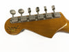 Fender Custom Shop electric guitar headstock with vintage-style tuning pegs and 30th anniversary logo 1987-2017 on wood grain finish