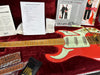 Burns Marvin electric guitar in red with vintage-style pickups and maple neck in red plush-lined hard case with pre-sales checklist, leather guitar straps, silica gel packets, and certificates including limited edition Burns Custom Signature and Tom Signature guitar brochures.