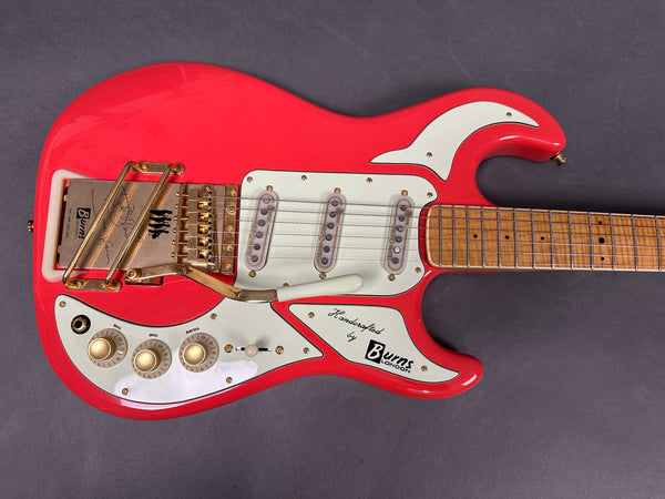 Red Burns London electric guitar with triple single-coil pickups, gold hardware, white pickguard, volume and tone knobs, and maple neck on gray background.