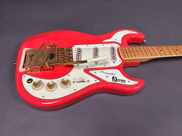Burns London electric guitar in bright red with white pickguard, gold hardware, three single-coil pickups, and maple neck, photographed on gray background