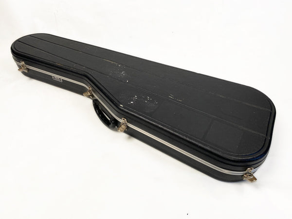 Black rectangular hard guitar case with silver latches and handle, designed for electric guitar storage and transport, shown on white background