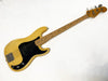Vintage Fender Precision Bass guitar in blonde finish with maple neck and black pickguard on white background
