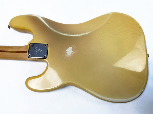 Vintage cream electric guitar body back with worn finish and metal neck plate on white background