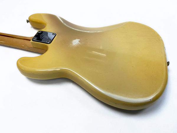 Vintage yellow electric guitar body with chrome neck plate and visible wear on white background