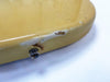 Close-up of worn yellow guitar body with chipped paint and metal strap button showing signs of use on white background