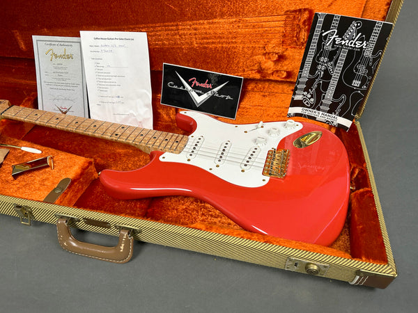 Fender Custom Shop electric guitar in Fiesta Red finish with maple neck, white pickguard, gold hardware, certified authenticity and owner's manual in vintage tweed hard case with orange plush interior
