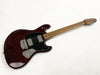 Solid body electric guitar with dark cherry finish, black pickguard, maple fretboard, and dual humbucker pickups on white background