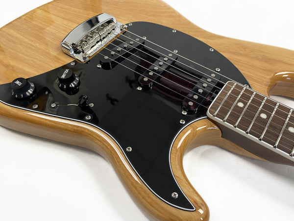 Natural wood finish electric guitar with black pickguard, dual single-coil pickups, chrome bridge, tone and volume control knobs, and rosewood fretboard close-up