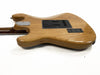 Back view of natural wood finish electric guitar with black plastic back plates and chrome neck plate on white background