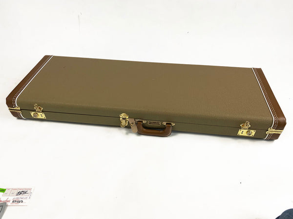 Fender vintage style hard shell guitar case with brown leather corners and handle on white background