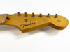 Close-up of natural wood Fender Stratocaster headstock with six tuning pegs and strings, showing "Original Contour Body" text and vintage-style logo on white background