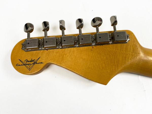 Fender Custom Shop vintage-style guitar headstock with six chrome tuning machines and natural wood finish